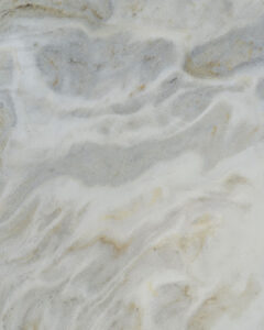Nova Bianco natural stone with bright white background and subtle gray movement, ideal for luxury countertops and wall cladding