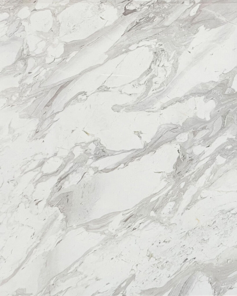 Volakas Marble natural stone with white background and elegant gray veining, ideal for luxury countertops and wall cladding